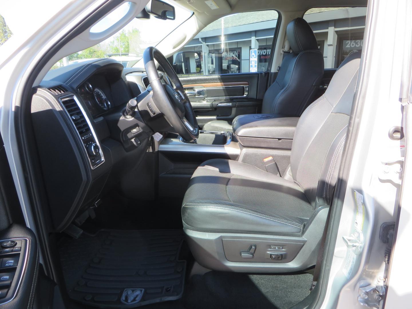 2016 SILVER /BLACK RAM 2500 Laramie Crew Cab SWB 4WD (3C6UR5FL3GG) with an 6.7L L6 OHV 24V TURBO DIESEL engine, 6A transmission, located at 2630 Grass Valley Highway, Auburn, CA, 95603, (530) 508-5100, 38.937893, -121.095482 - Leveled Ram sitting on Fuel Offroad wheels, Falken Wildpeak AT tires, Amp Power steps, Rolling Bed cover, Color matched fender flares, and window tint. - Photo#16